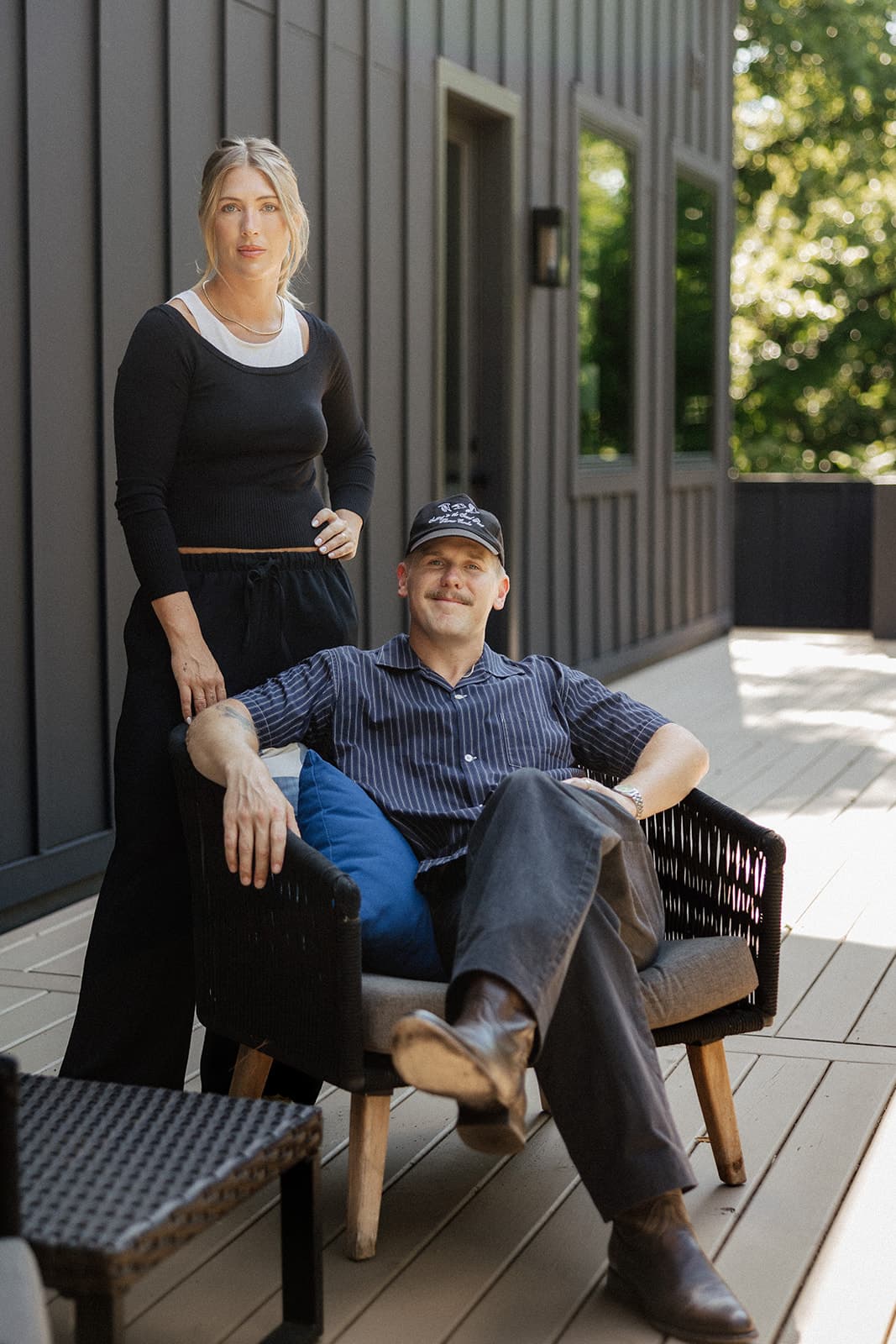 Ryan and Cassie Boggs together on a covered porch