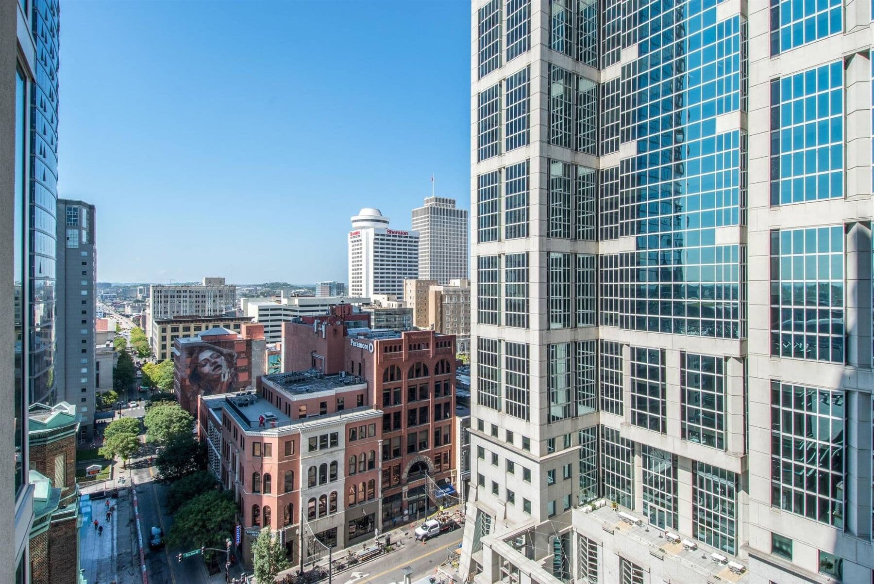 Downtown Nashville skyline with historic brick buildings and glass towers