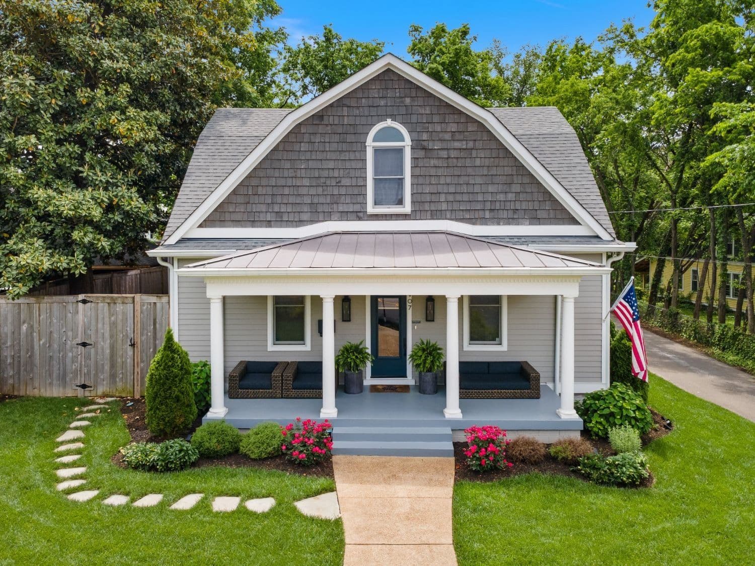 Sold: gray gambrel cottage with a columned front porch in 12 South, Nashville